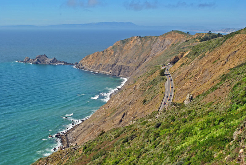 Headlands and San Pedro Rocks and Devil's Slide when it was still a highway. Many speculate that dark spot on headlands by ocean is a drain or cave, but is just a shallow recess of dark rock surrounded by light rock