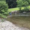 We found a nearby shallower area to cross the river. Ended up being about waist-high in June. Watch for snakes in the rocks, too.