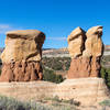 Hoodoos continue to be sculpted in Devils Garden while Fiftymile Mountain stands in the background.