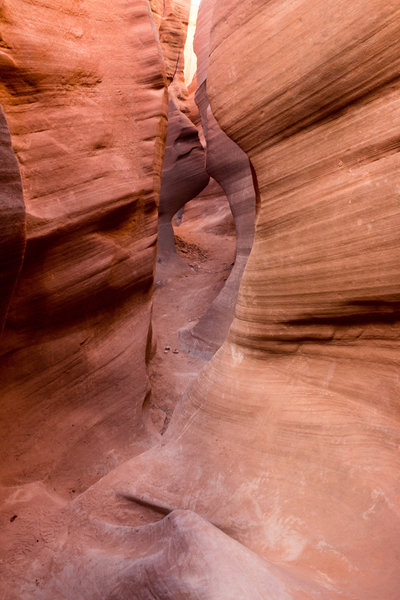 Squeezing through Peek-a-boo Gulch.