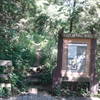 The Cave Spring Trailhead at Devils Well is marked by this large sign.