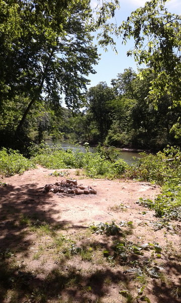 The Current River runs alongside the Cave Spring Trail.