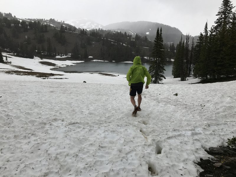 At Clark Lake, snow's on the ground and still falling in the middle of June. Respect the mountain.