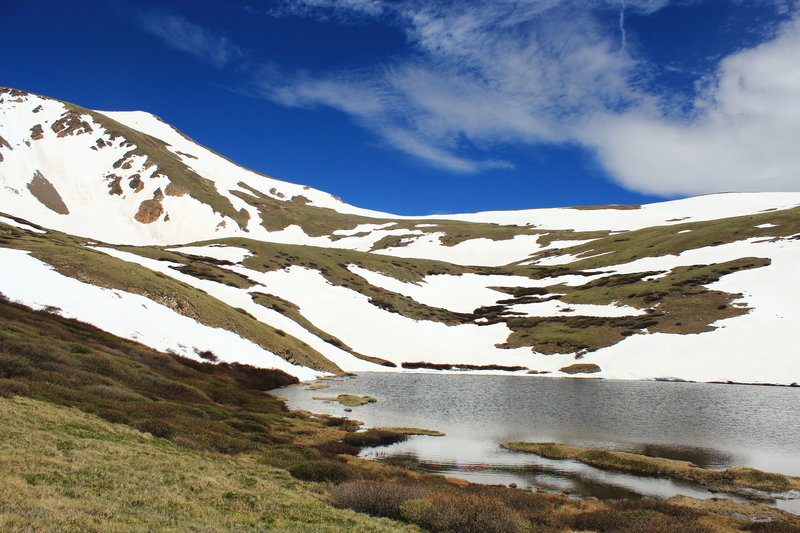 Snow lingers on the summit above Lower Square Top Lake in early summer 2017.