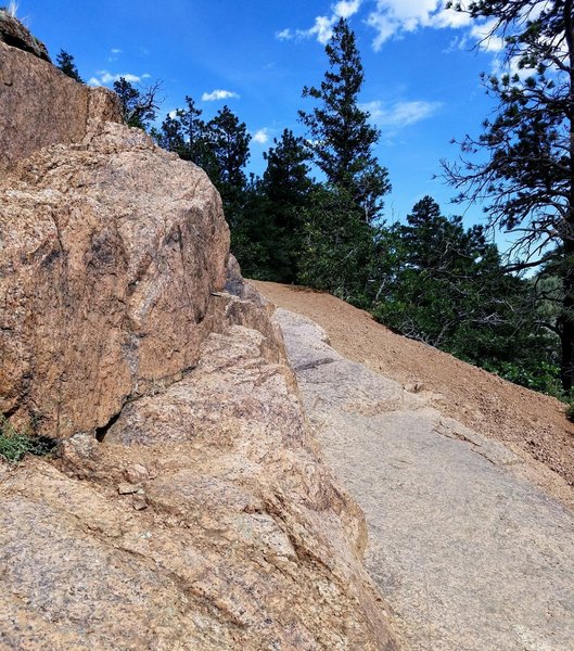 The trail requires climbing over rock slabs and sure footing as you navigate its loose sections.