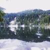 In early summer, almost all of the ice is gone from Mason Lake, leaving a beautiful reflection.