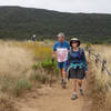 Colorful hikers enjoy Los Peñasquitos Canyon near the waterfall.