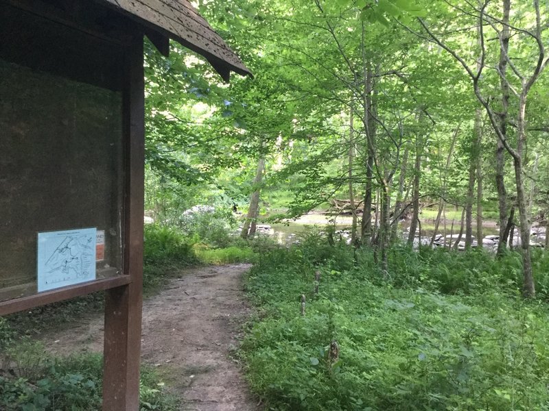 Trail signage is plentiful near the footpath to the river.