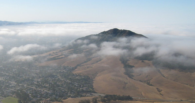 Cerro San Luis peeks through the clouds from Bishop Peak.