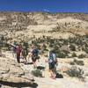 The team hikes along the Boulder Mail Trail with a lunar backdrop.