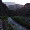 Late-afternoon light trickles through Colorado Canyon at the mouth of Bright Angel Creek.