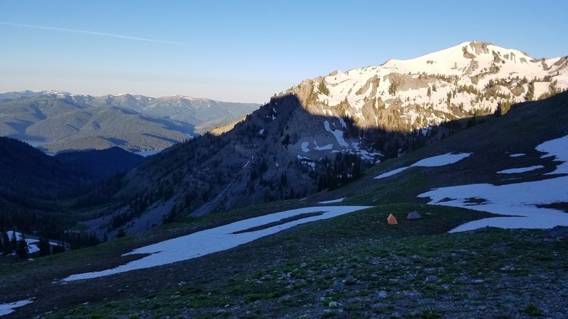 There's a nice flat spot to camp just downhill of the ridge looking toward Sheep Creek Peak.