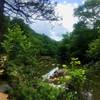 The rocky Eno River flows beside the trail.