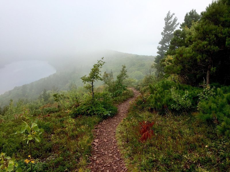 Escarpment trail in fog, with Lake Superior at right, Lake of the Clouds at left.