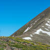 A couple takes a nice rest among the wildflowers before the final ascent to Quandary Peak.