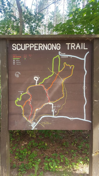 An informative trail map kiosk is located at the start of the trail.