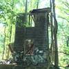 Ruins of an old house, maybe a mill house, with graffiti.