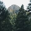 Enjoy a great view of Stove Mountain (9782 ft.) from St. Mary Falls Trail.