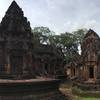 Observing the intricate carvings at Banteay Srei.