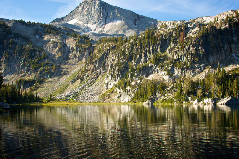 Mirror Lake reflects the craggy rocks up to Eagle Cap.