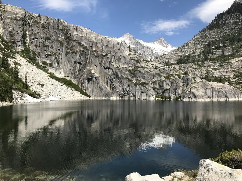 Dramatic granite headwall on Upper Canyon Creek Lake in Trinity Alps Wilderness