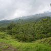 Arenal Volcano shrouded in low clouds.