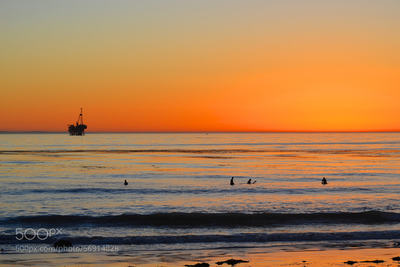 Surfers and Platform Holly at Sunset: Just after sunset, viewed from Coal Oil Point, adjacent the UCSB campus.
