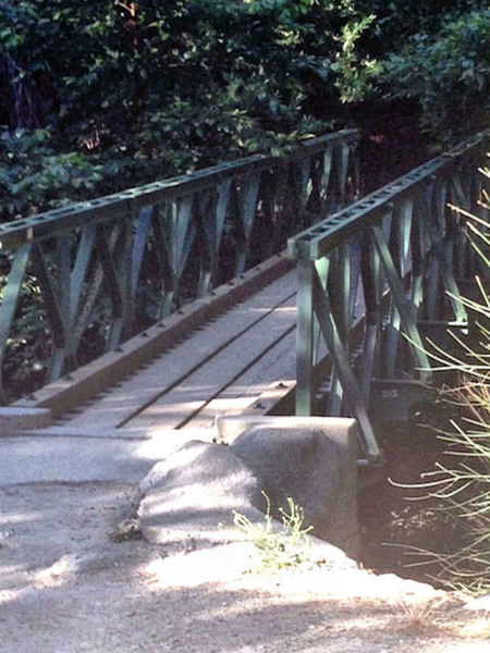 Foot bridge at Robert's Camp. Cross the bridge or head through the creek and start the climb up the paved fireroad to the Chantry Flat parking lot.