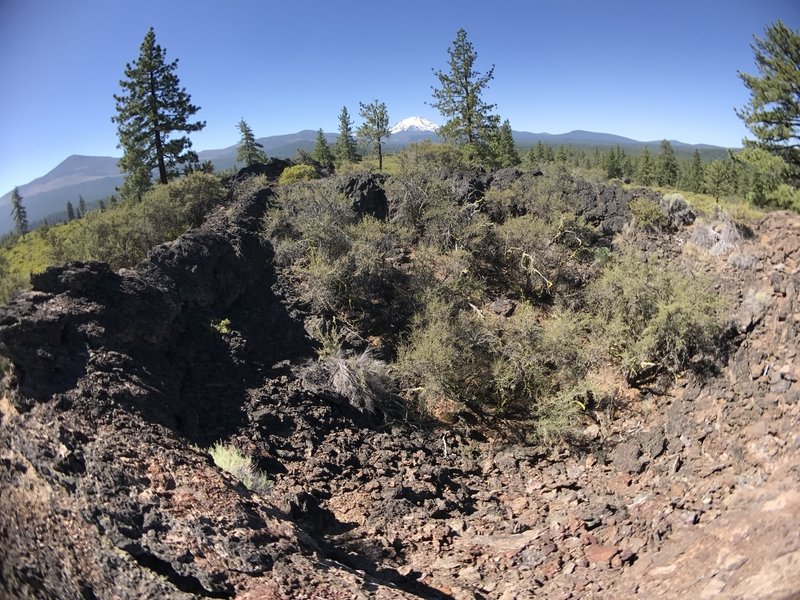 View over the rim of a spattercone, looking south towards Mt. Lassen.