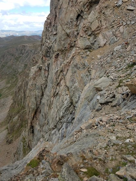 Upper third, right edge, tiny yellow dot... Yup, that is a full-size man crossing the north face lower catwalk of The Sawtooth.