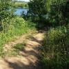 The trail has views of the lake.