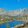 Looking east from gap leading to Sixty Lakes Basin. Dragon Peak is in the center on the far ridge. Black Mtn, 13290 ft., is on the left side