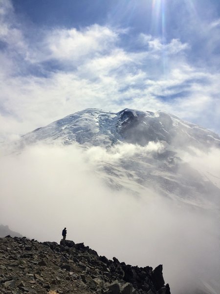 Mount Rainier peaking out from the clouds. At the top of Third Burroughs.