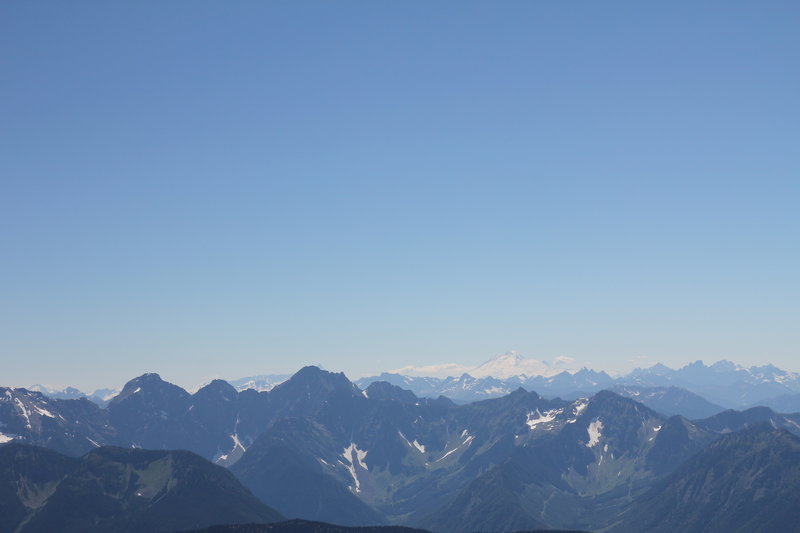 From Summit of Mount Outram: Mount Baker with Mount Slesse and Rexford to the right, and Mount Rideout and Payne to the left