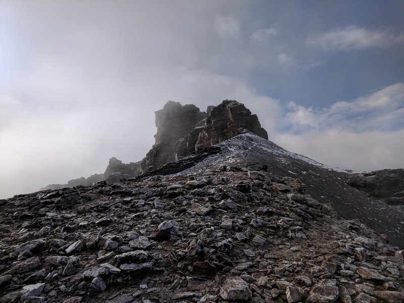 The summit outcrop; the easiest path is around back and on the South side.