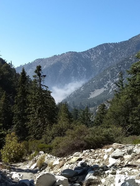 Trail view of the fog rolling into the canyon on Icehouse