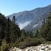 Trail view of the fog rolling into the canyon on Icehouse