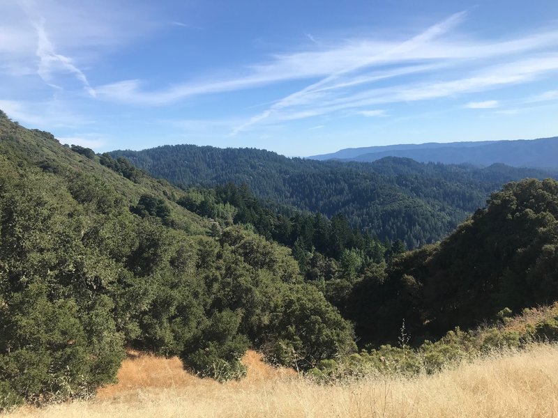 Views of the surrounding mountains spread out before you as you make your way along the trail.