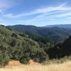 Views of the surrounding mountains spread out before you as you make your way along the trail.