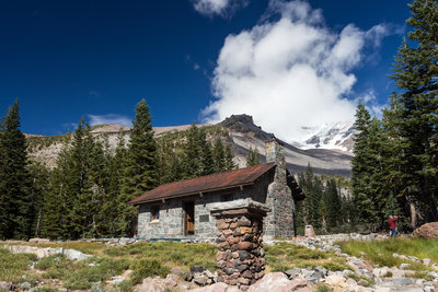 Sierra Club Horse Camp in front of the cloudy summit of Mount Shasta
