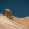 Hikers on Sherman's ridge behind old mining structures.