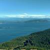 View looking east-northeast, San Juan Islands with Mt Baker in the center in the distance.