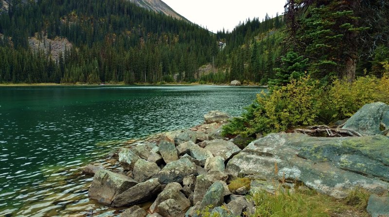 The blue-green waters of the first Geraldine Lake and the waterfall at its far end.