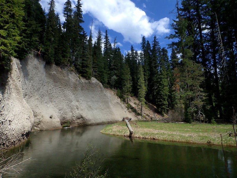 Pumice cliffs above a quiet reach of the Upper Rogue River.