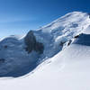 Looking up at the summit of Mt. Blanc. The Bosses Ridge is on the right, with the Vallot Hut at the base of it.