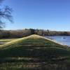 A scenic trail along the top of the earthen dam.