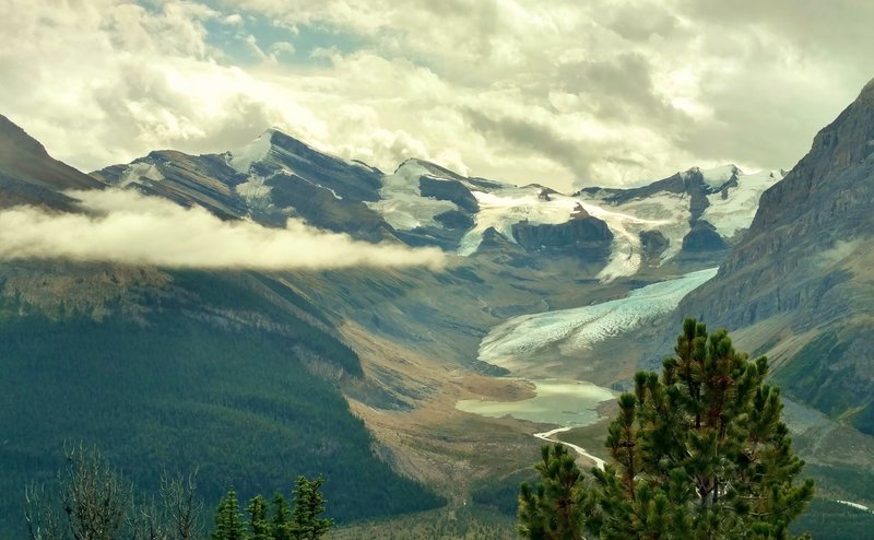 Robson River at its sources - Lynx Mountain (left), Resplendent Mountain (right), Robson Glacier (center right), and other snowy peaks. Looking southeast from high on Mumm Basin Route.