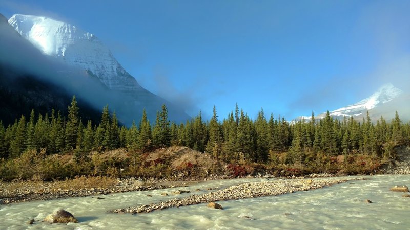 Silt laden headwaters of Robson River run swiftly as they start their journey to the Pacific Ocean. Mt. Robson is on the left, and Whitehorn Mountain is in the distance on the right.