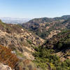 Valley cut into the volcanic rock next to Oat Hill Mine Trail.