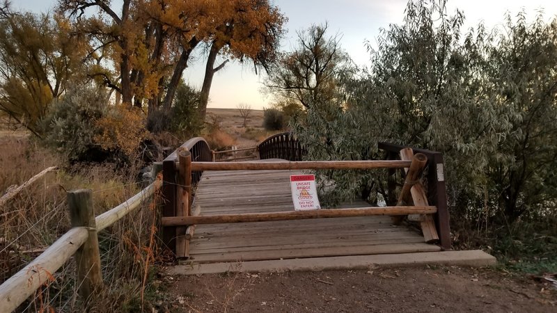 Northbound, this is the sign at the bridge that was pushed off its foundation during the 2013 flood. Still out as of Oct 19, 2017.